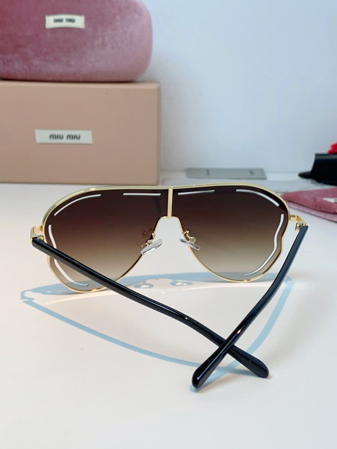 MIUMIU 26S SHIELD FRAME IN METAL 424496
