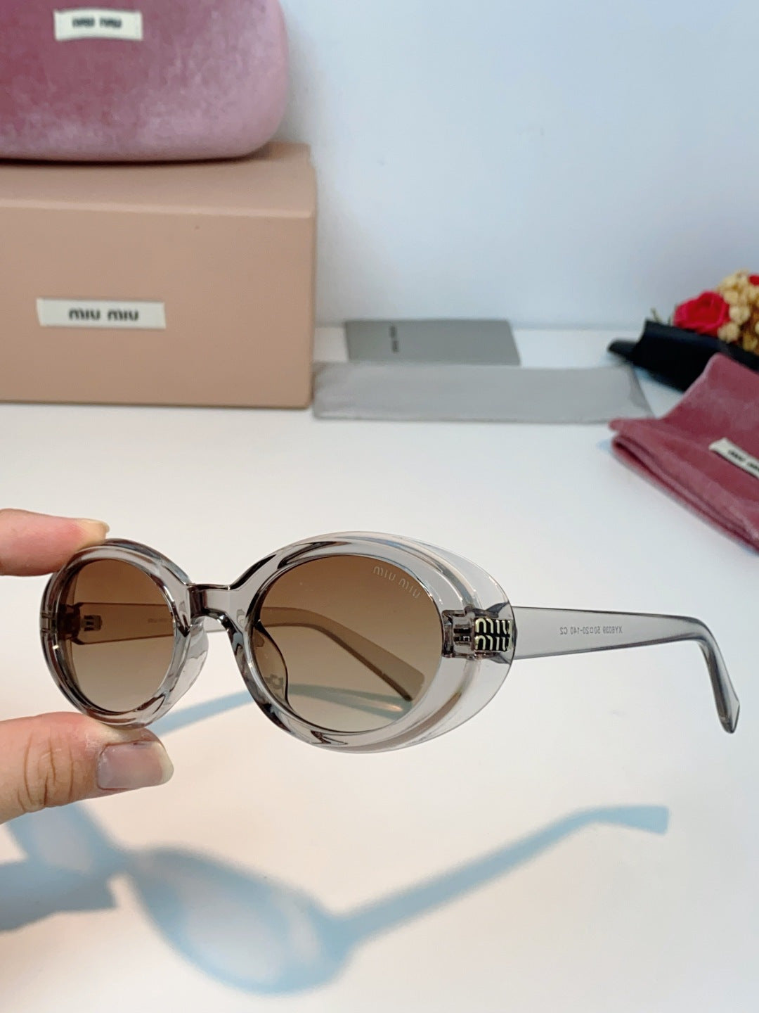 MIUMIU 26S OVAL FRAME IN ACETATE 424528