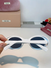 MIUMIU 26S OVAL FRAME IN ACETATE 424531