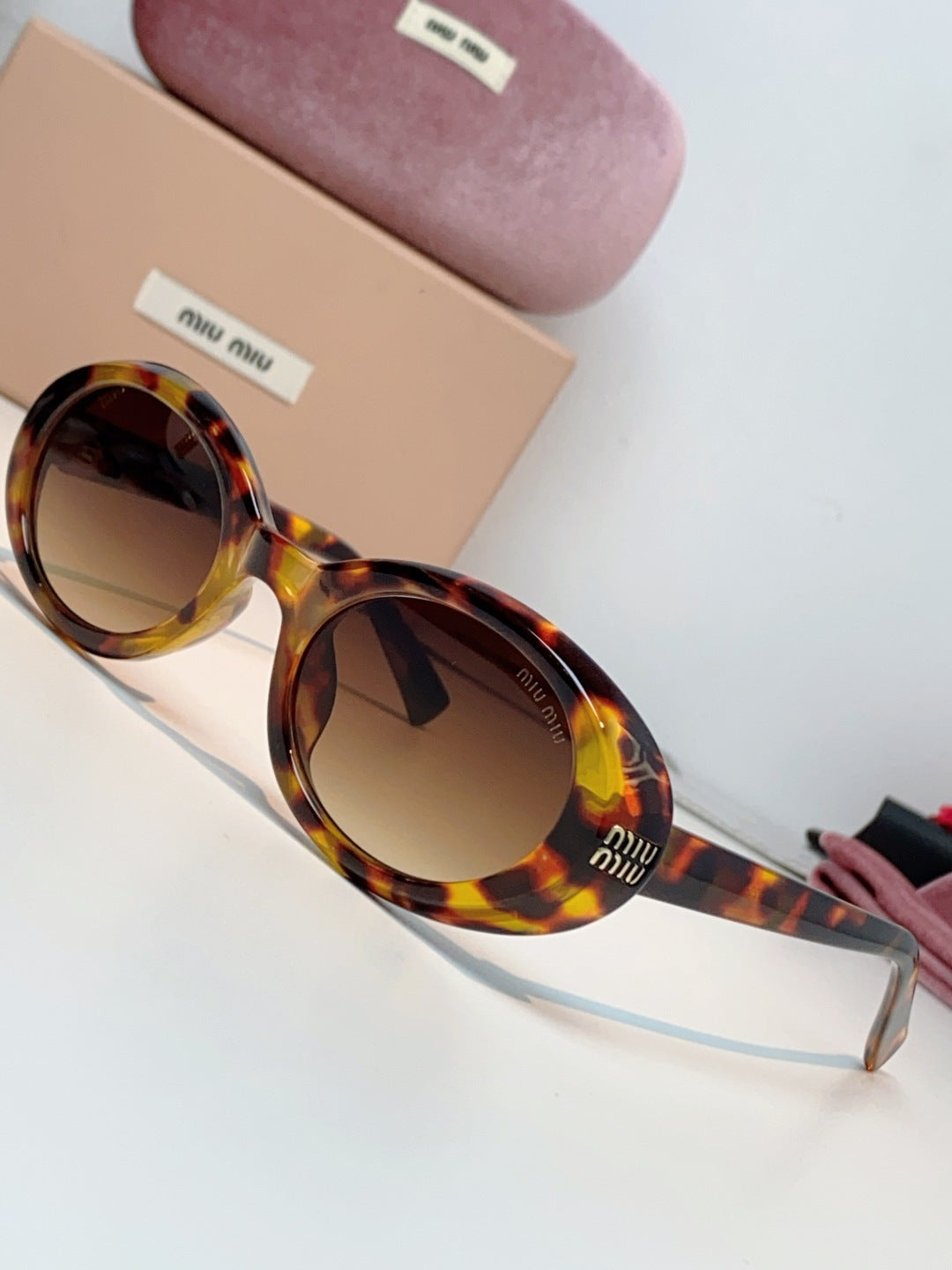 MIUMIU 26S OVAL FRAME IN ACETATE 424532