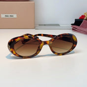 MIUMIU 26S OVAL FRAME IN ACETATE 424532