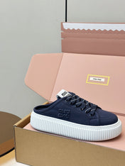 MIUMIU 26S SNEAKER MULES IN NAVY BLUE CANVAS