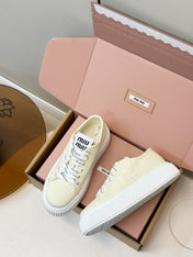 MIUMIU 26S PLATFORM SNEAKERS IN LIGHT YELLOW CANVAS