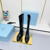 PRADA 25S POINTED TALL BOOTS 50MM IN BLACK GLOSSY CALFSKIN WITH LOGO