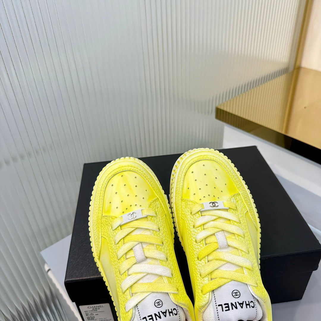 CHANEL 26S LOW-TOP SNEAKERS IN LIGHT YELLOW GRAFFITI PATTERN CALFSKIN