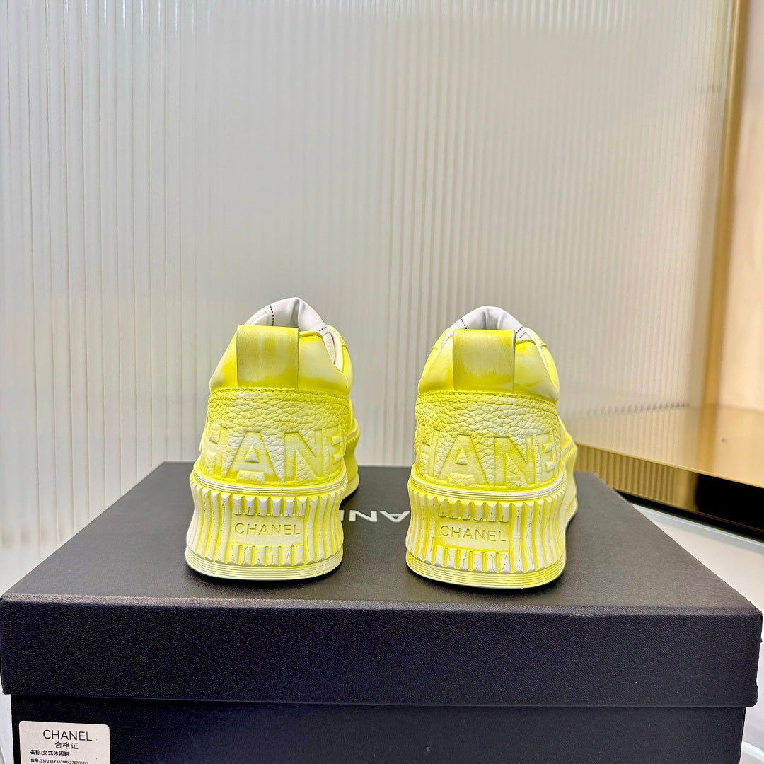 CHANEL 26S LOW-TOP SNEAKERS IN LIGHT YELLOW GRAFFITI PATTERN CALFSKIN