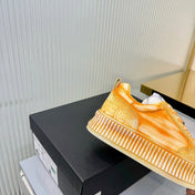 CHANEL 26S LOW-TOP SNEAKERS IN GOLDEN ORANGE GRAFFITI PATTERN CALFSKIN