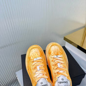 CHANEL 26S LOW-TOP SNEAKERS IN GOLDEN ORANGE GRAFFITI PATTERN CALFSKIN