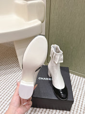 CHANEL 25S ANKLE BOOTS IN  WHITE CALFSKIN AND BLACK GLOSSY TOE RUCHED