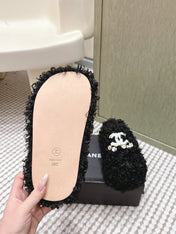 CHANEL 25S CLASSIC FURRY SLIDES IN BLACK WITH DOUBLE C LOGO