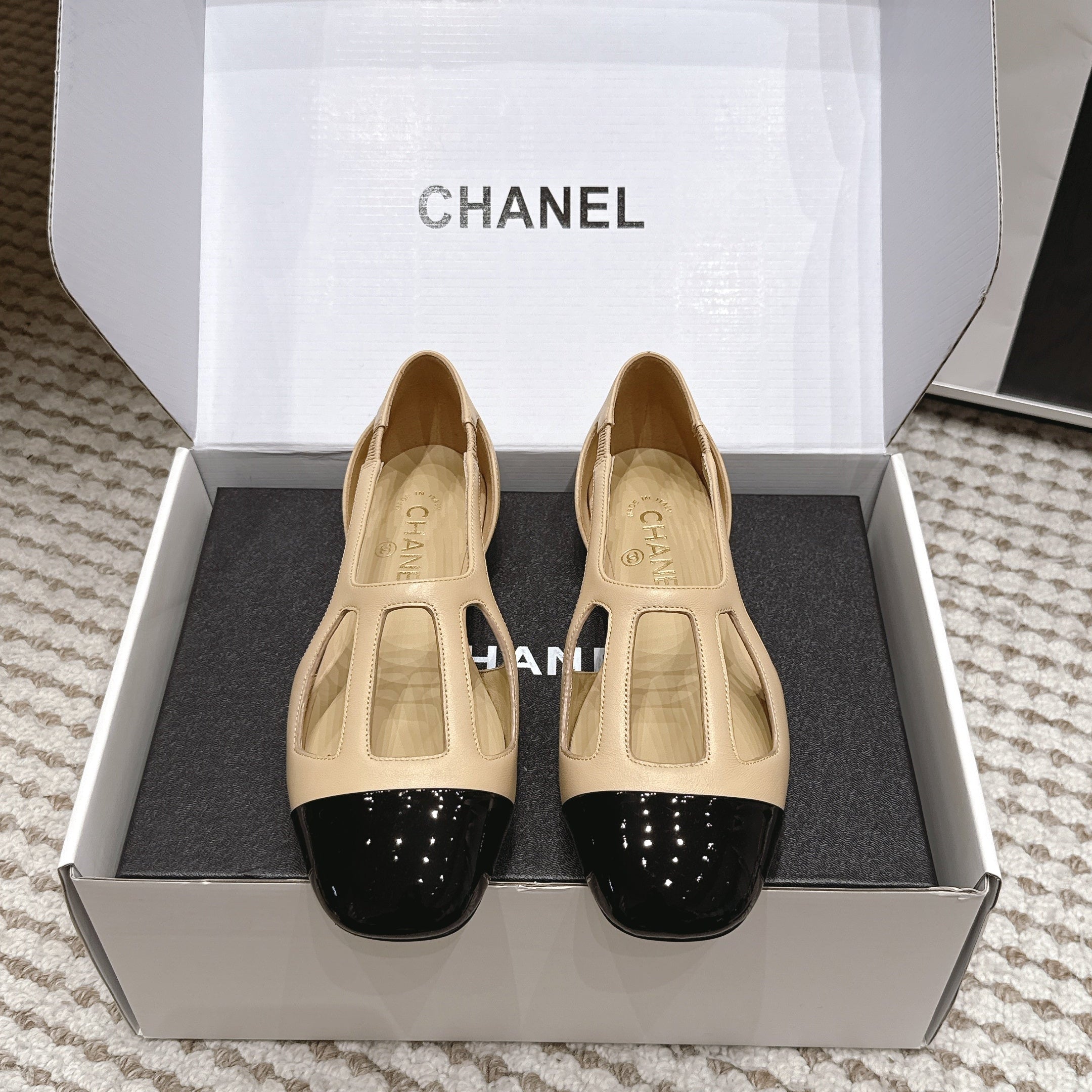 CHANEL 26S ROUND TOE MARY JANE FLATS IN OFF BEIGE CUTOUT CALFSKIN WITH BLACK PATENT TOE