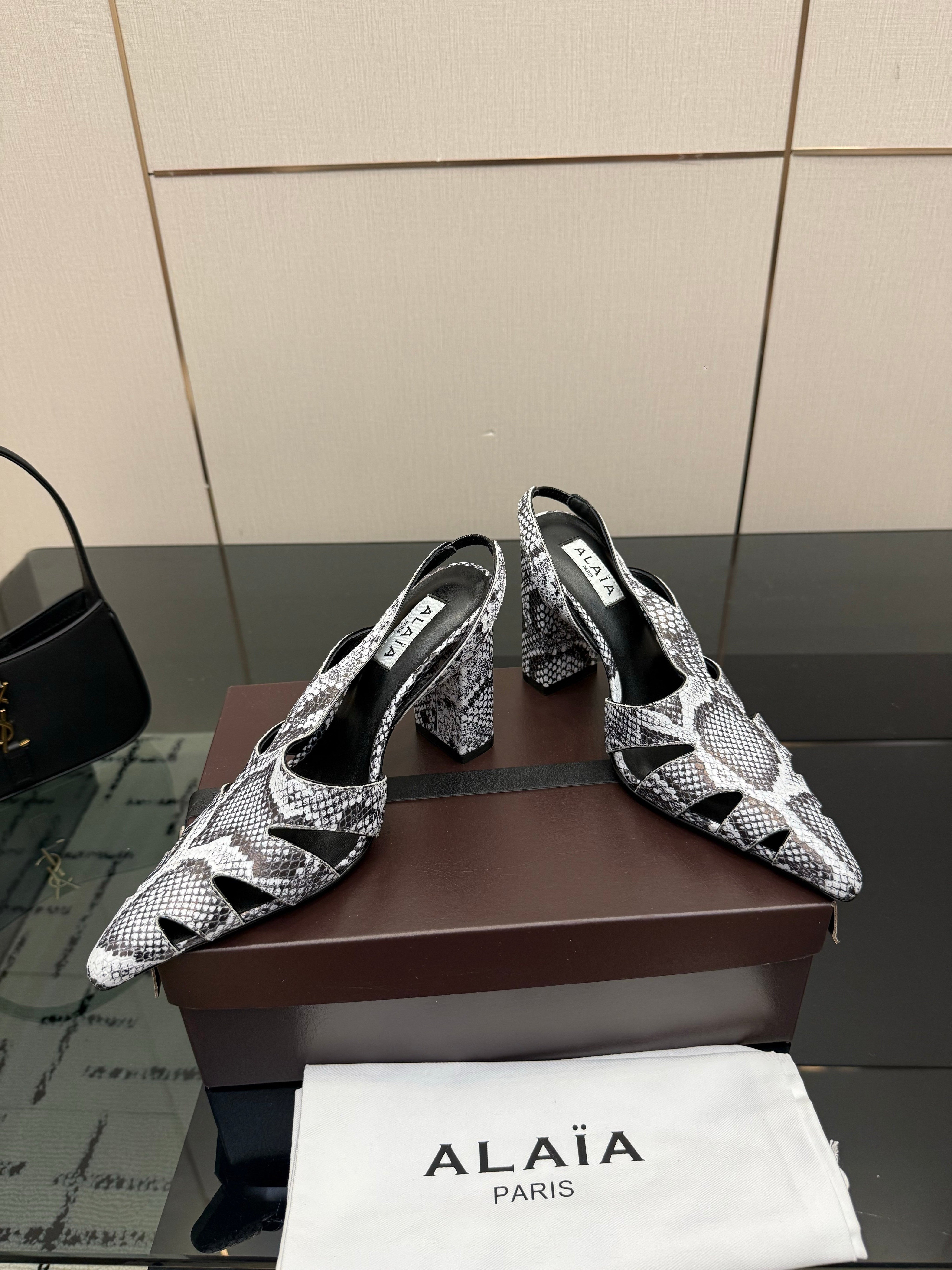 ALAIA 26S HEELED SLINGBACKS IN PYTHON-EMBOSSED LEATHER
