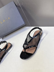 ALAIA 26S FLAT MESH THONG SANDALS IN BLACK PATENT CALFSKIN