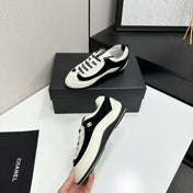 CHANEL SNEAKERS METIERS D-ART 26S IN BLACK AND WHITE CALFSKIN