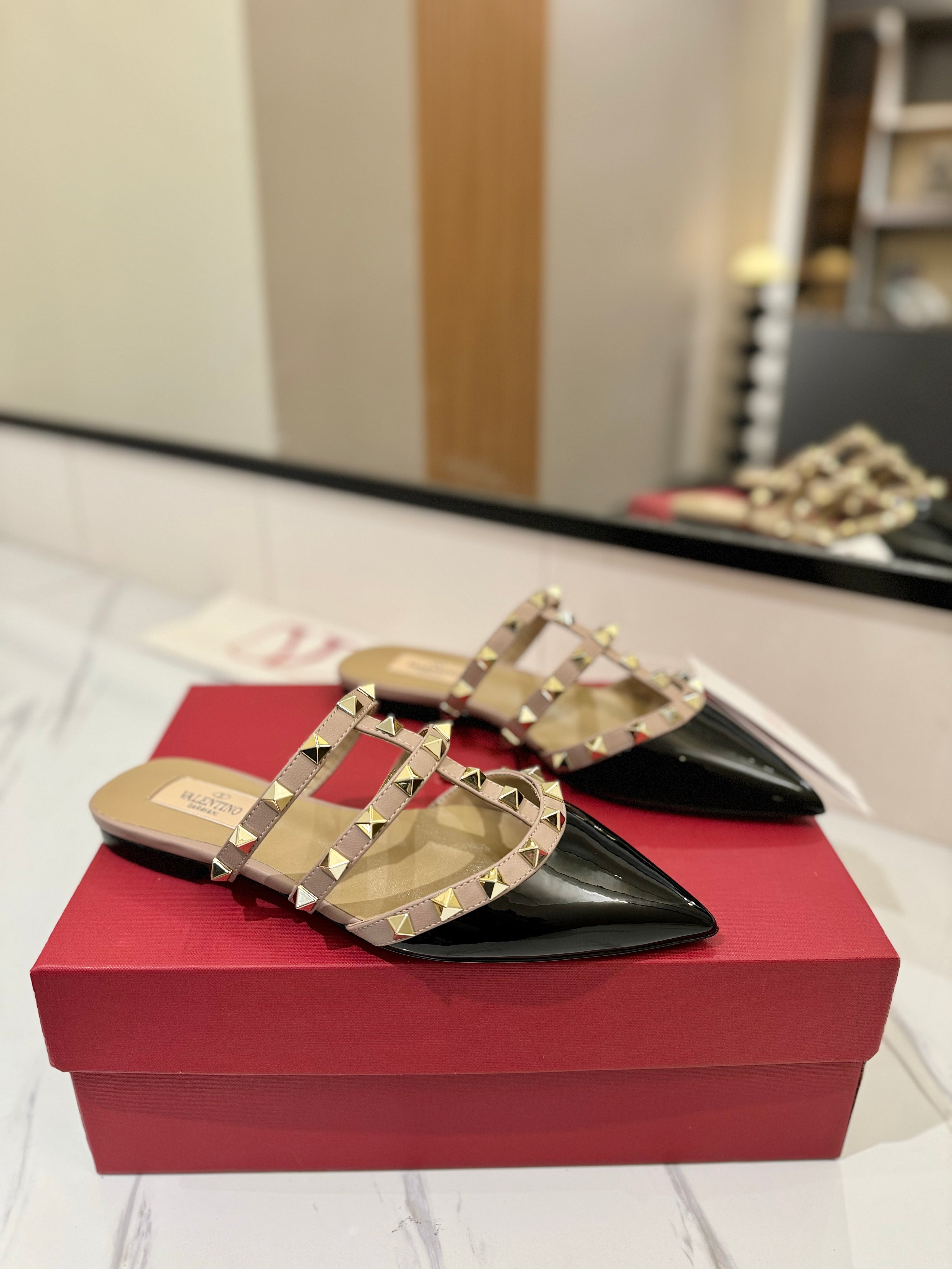 VALENTINO 26S STUDDED FLAT MULES IN BLACK PATENT CALFSKIN