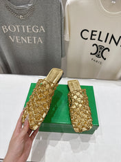 BOTTEGA VENETA 26S WOVEN MULES IN GOLD LAMBSKIN