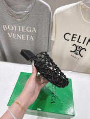 BOTTEGA VENETA 26S WOVEN MULES IN BLACK LAMBSKIN