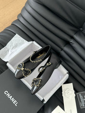 CC BALLET FLATS IN BLACK LAMBSKIN WITH GOLD HARDWARE