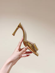 TRUMPET METALLIC MULES IN GOLD PATENT CALFSKIN