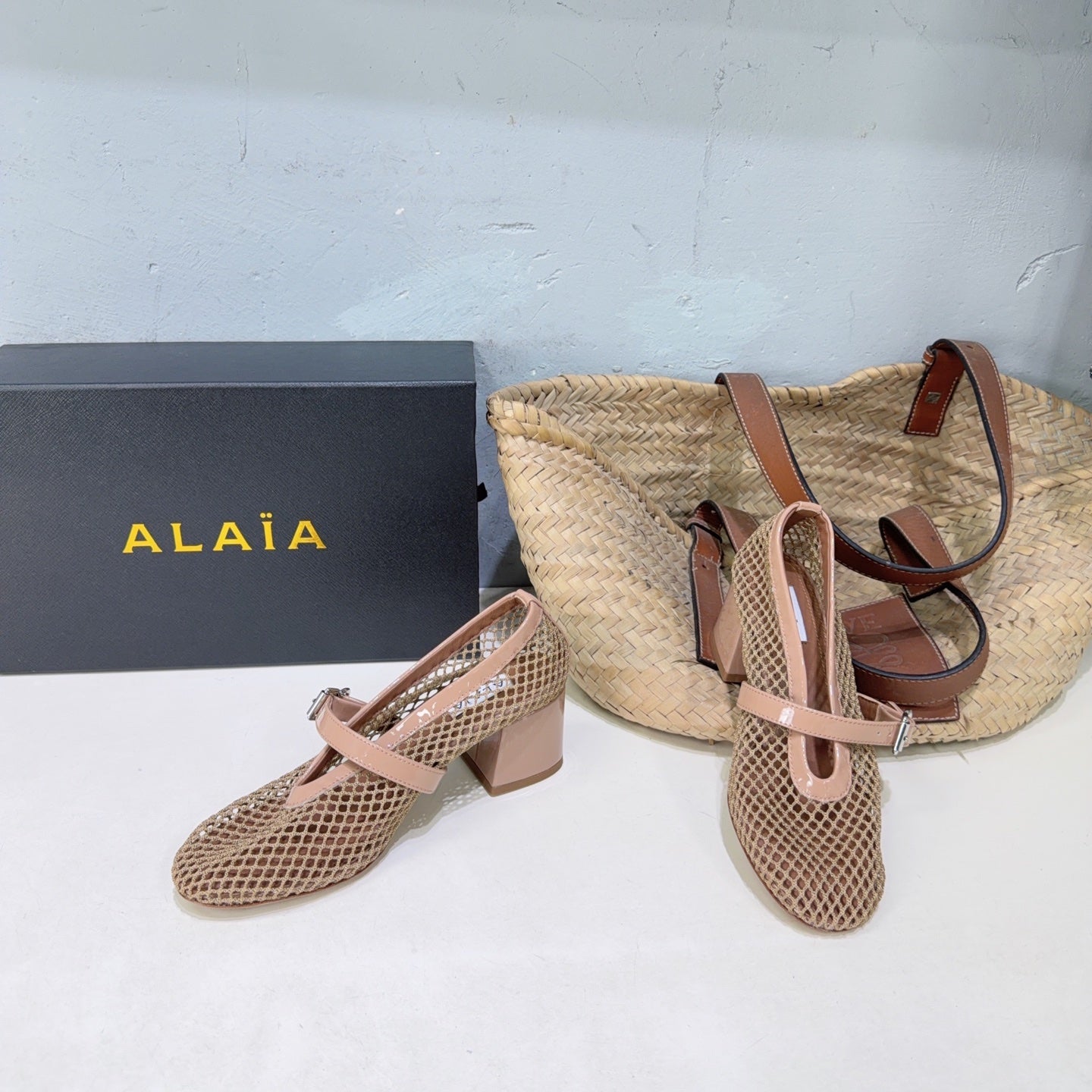 ALAIA 26S HIGH-HEEL MARY JANES 50 MM IN NUDE WOVEN MESH