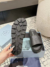 PRADA 25S RUBBER SLIDE IN BLACK CALFSKIN WITH LOGO