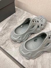 CUT-OUT MULES IN GRAY RUBBER