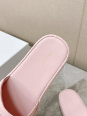 THICK-SOLED SLIDES IN LIGHT PINK SMOOTH LAMBSKIN LOGO WITH CRYSTALS