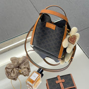 CELINE 25S SMALL CUBE BAG 21MM IN BLACK TRIOMPHE CANVAS AND BORWN CALFSKIN