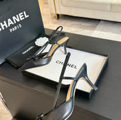 SLINGBACK WITH BOW IN BLACK LAMBSKIN