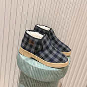 MIUMIU 25S SLIP-ON BOOTIES IN BLACK AND BLUE WOOL WITH SHEARLING