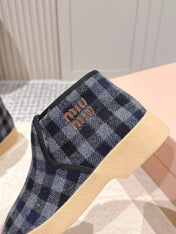MIUMIU 25S SLIP-ON BOOTIES IN BLACK AND BLUE WOOL WITH SHEARLING