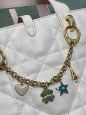 DIOR 25S TOUJOURS VERTICAL TOTE BAG 18 IN LIGHT PINK CALFSKIN WITH CHARM BRACELET STRAP