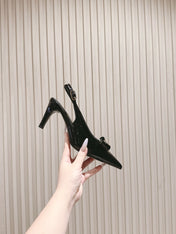 CC HIGH SLINGBACK IN BLACK LAMBSKIN WITH BOW ATTACHED