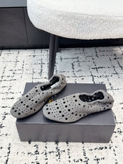 ALAIA 26S FLAT SLIP-ONS IN GREY SUEDE WITH OPENWORK PATTERN