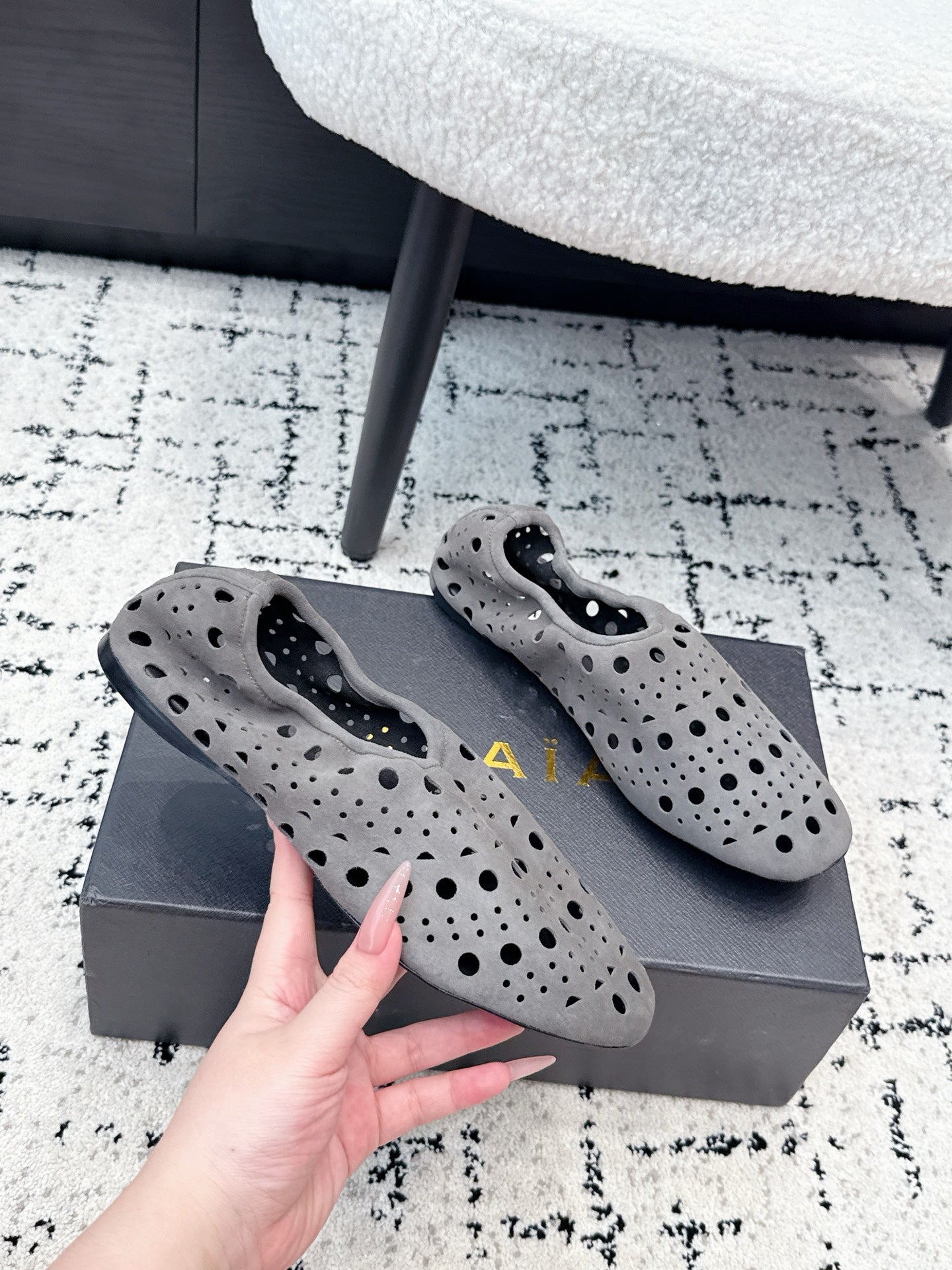 ALAIA 26S FLAT SLIP-ONS IN GREY SUEDE WITH OPENWORK PATTERN