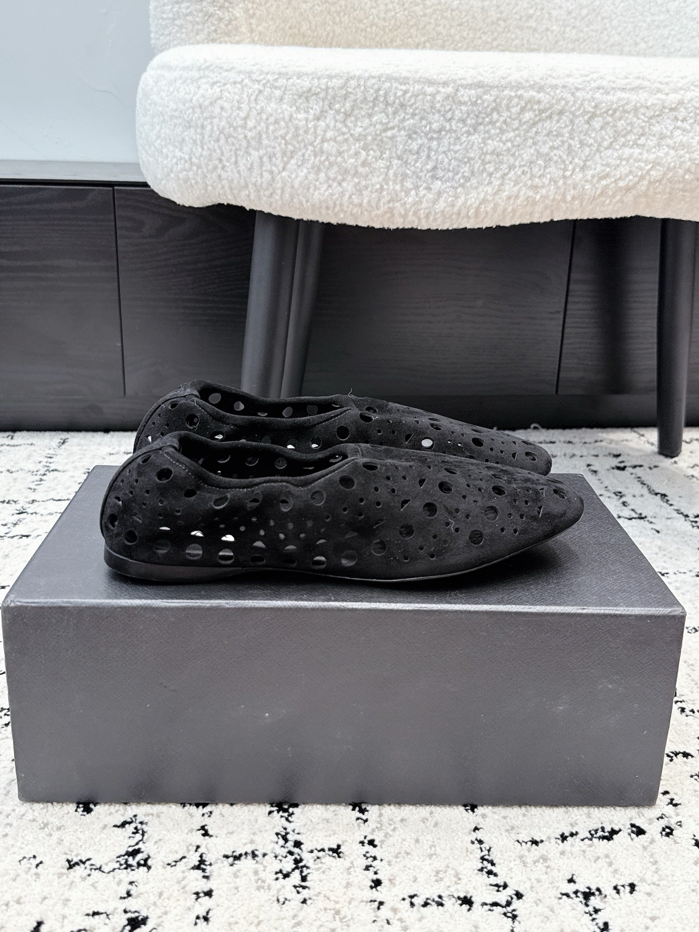 ALAIA 26S FLAT SLIP-ONS IN BLACK SUEDE WITH OPENWORK PATTERN