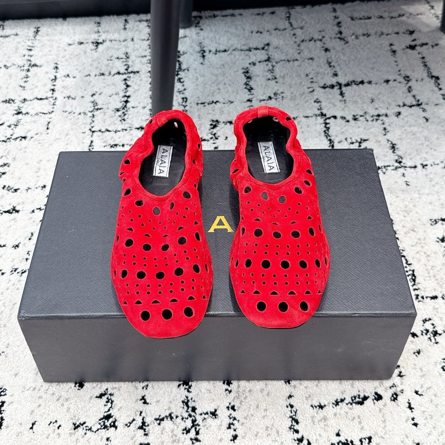 ALAIA 26S FLAT SLIP-ONS IN RED SUEDE WITH OPENWORK PATTERN