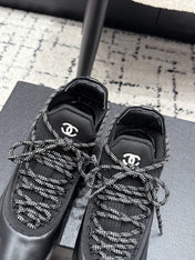 CHANEL 26S LACE-UP SNEAKERS IN BLACK FABRIC AND LAMBSKIN