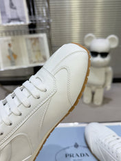 PRADA 26S LACE UP SNEAKERS IN WHITE CALFSKIN