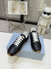 PRADA 26S LACE UP SNEAKERS IN BLACK CALFSKIN