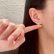 DOUBLE C STUD EARRINGS IN GOLD METAL FULLY DIAMOND