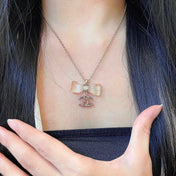 CHANEL 26S DOUBLE C LOGO CLEAR BOW PENDANT NECKLACE IN GOLD METAL 629174