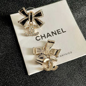CHANEL 26S DOUBLE C LOGO CRYSTAL BOW DROP EARRINGS IN GOLD METAL 629981