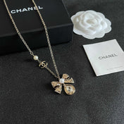 CHANEL 26S DOUBLE C LOGO PEARL BOW & CRYSTAL DROP NECKLACE IN GOLD METAL 629884