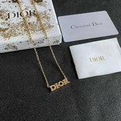 CD 26S PAVE LOGO LETTER NECKLACE IN GOLD TONE METAL 631806