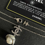 CHANEL 26S DOUBLE C LOGO PEARL DROP PENDANT NECKLACE WITH CRYSTAL HALO IN SILVER METAL 633293