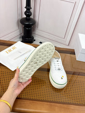 DIOR 26S LOW TOP SNEAKERS IN WHITE CANVAS WITH DAISY EMBROIDERY