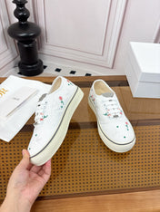 DIOR 26S LOW TOP SNEAKERS IN WHITE CANVAS WITH FLORAL EMBROIDERY