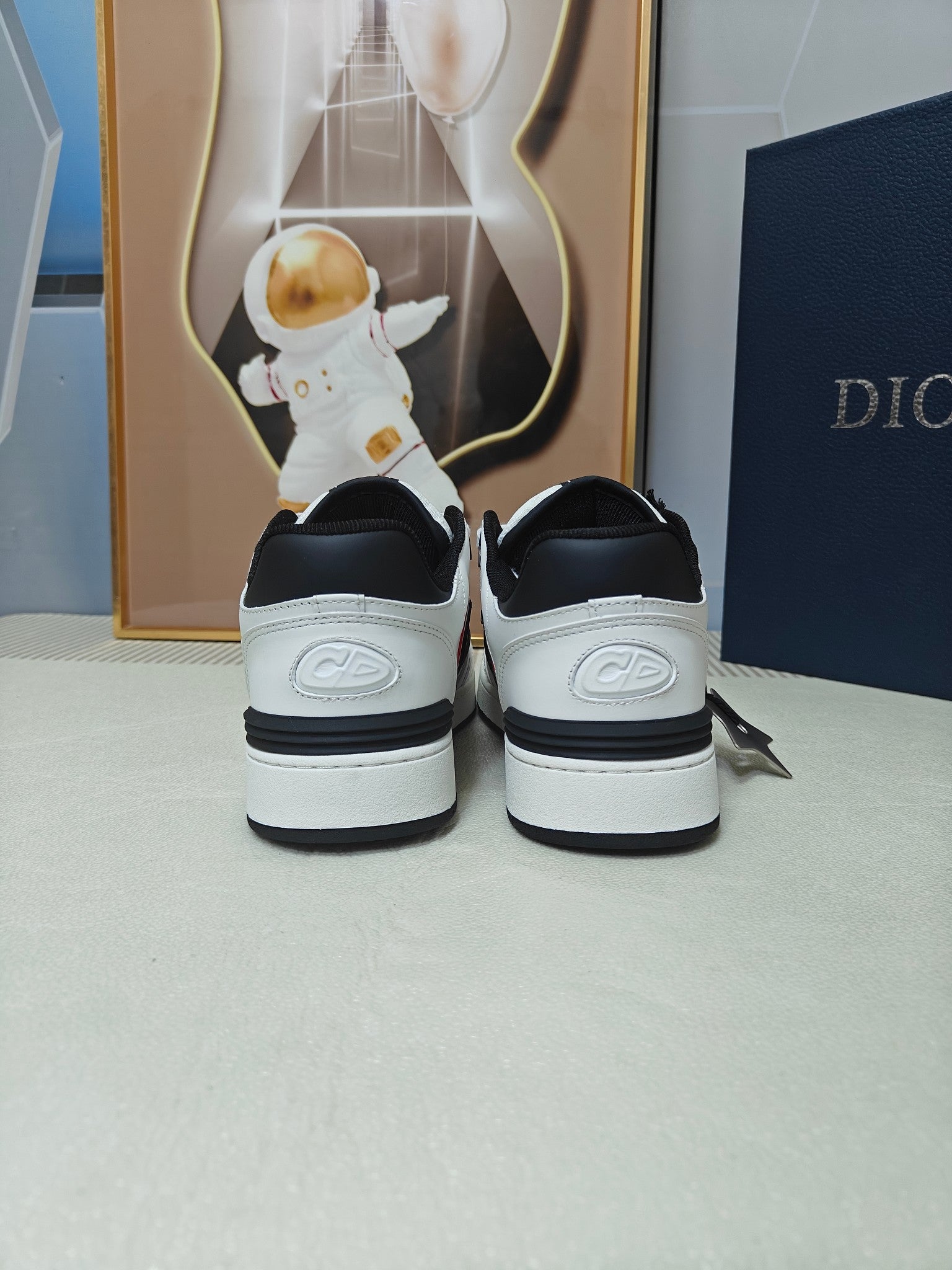 DIOR 26S LOW-TOP SNEAKER IN WHITE AND BLACK CALFSKIN