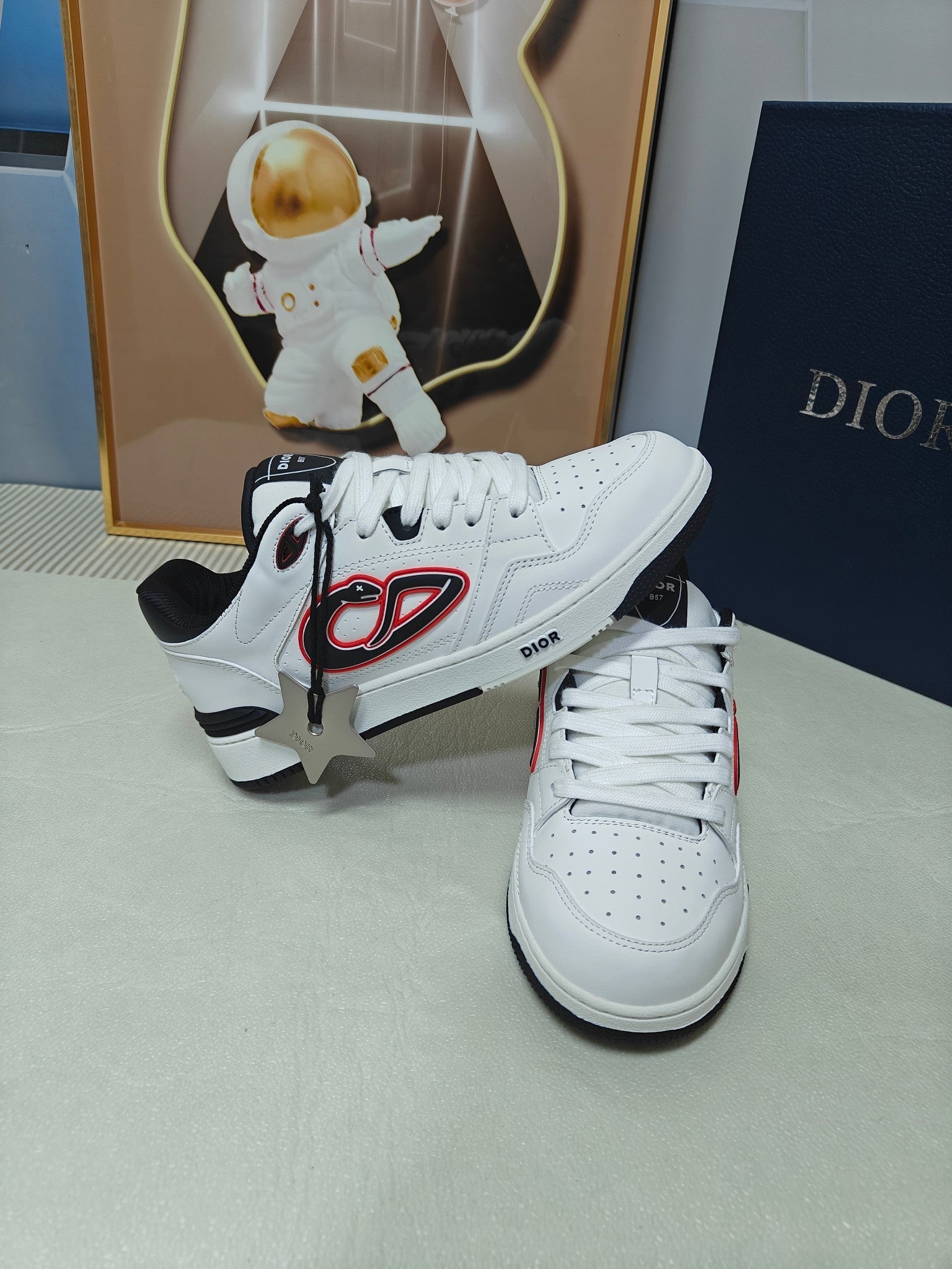DIOR 26S LOW-TOP SNEAKER IN WHITE AND BLACK CALFSKIN